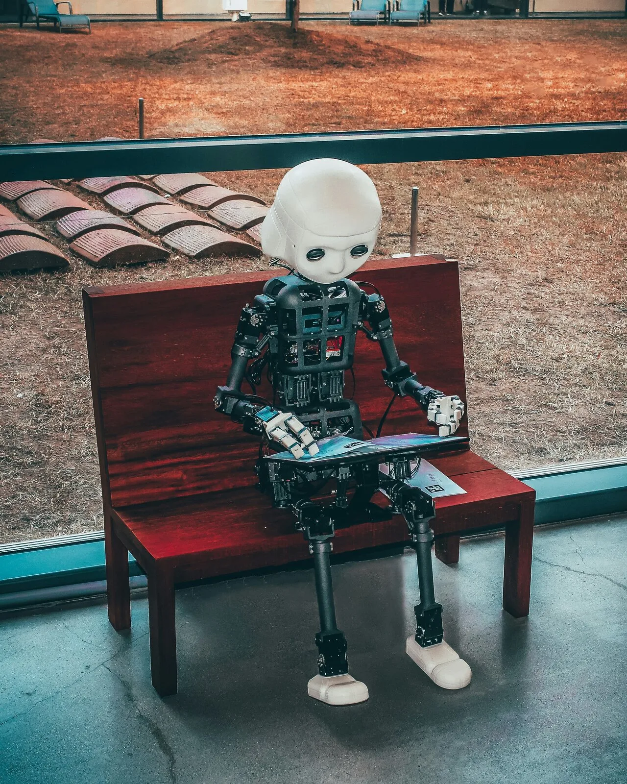 AI robot on a wooden bench