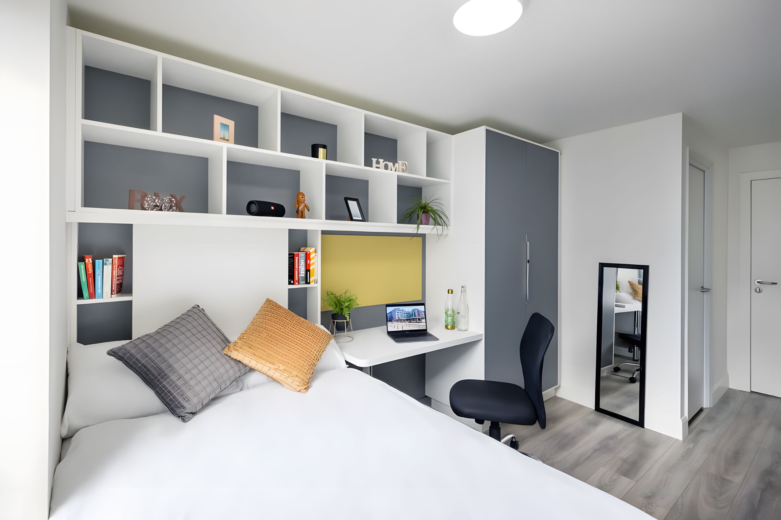 Student bedroom with desk, shelving and mirror, NCI residence